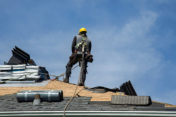 Professional Roof Replacement technician working in White Cloud, MI